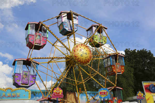 Small Ferris wheel for children, fairground in Ulm Friedrichsau, folk festival, hustle and bustle,