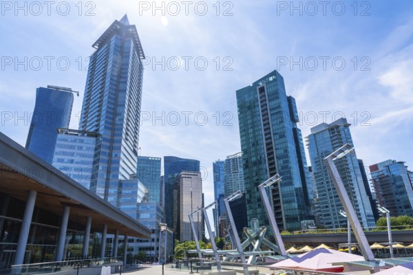 Glass skyscrapers and modern architecture dominate the skyline of vancouver, british columbia, on a
