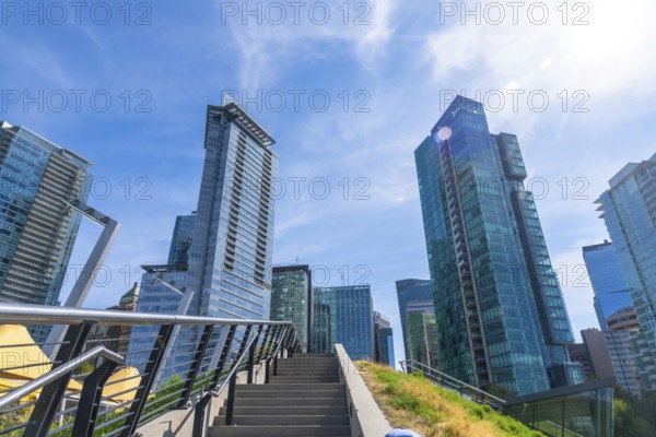 Modern skyscrapers dominate the skyline of vancouver, british columbia, seen from a low angle