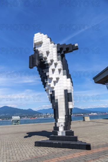 Pixelated orca sculpture overlooking the scenic waterfront in vancouver, british columbia,
