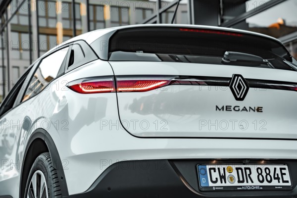 Rear view of a white Renault Megane with highlights on the design of the rear lights, Deer