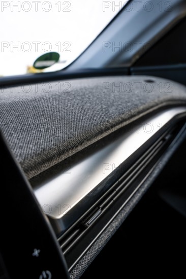 Close-up view of a car with fabric-covered dashboard in modern design, Deer E-Carsharing, Renault