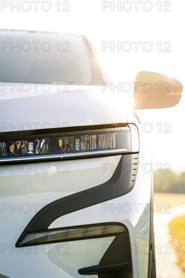 Modern white car body viewed from the front in sunlight, Deer e-Carsharing, Renault Megane, Calw,
