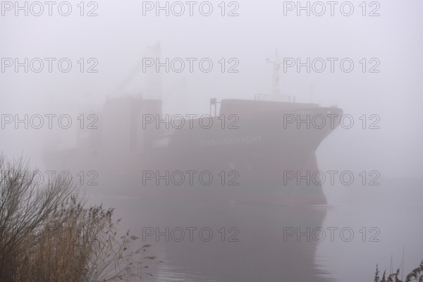 Freighter STADIONGRACHT in fog in the Kiel Canal, NOK, Kielkanal, Kielcanal, Schleswig-Holstein,