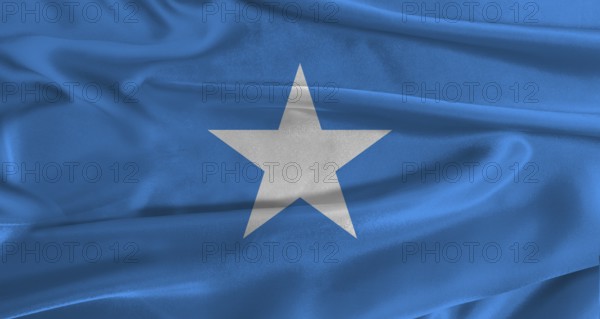 Flag of Somalia with fabric textured background. Close up of National flag of Somalia with