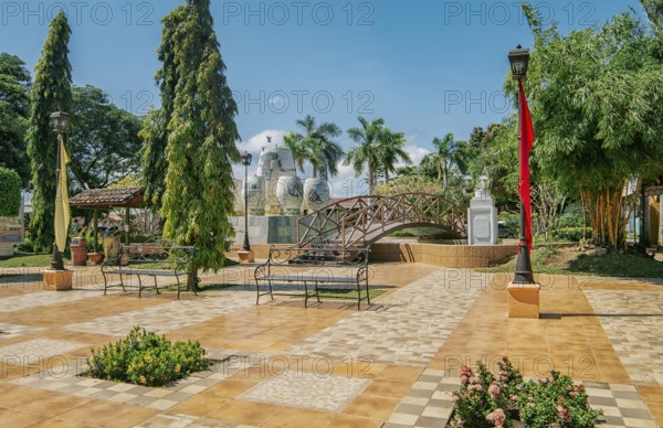 A nice and relaxed park with a wooden bridge over a water fountain, Traditional park of Nagarote,