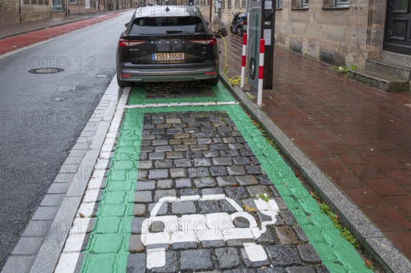Electric car charging at a marked charging station in the inner city, Fürth, Middle Franconia,