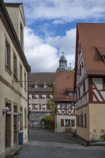 Historic half-timbered houses from 1592, in the back the former castle, built in the 16th century,