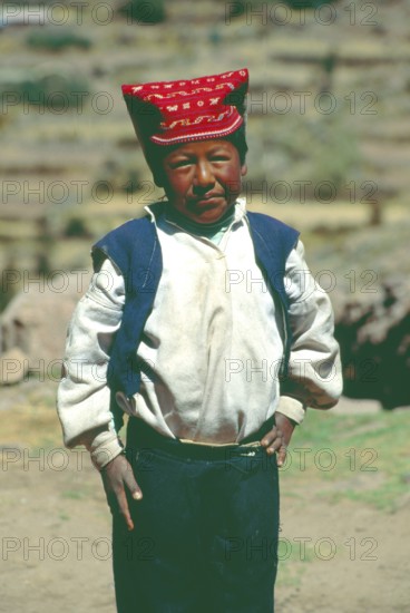 Little boy wearing traditional clothes on Isla Taquile in Lake Titicaca, Andean Highlands, Peru,