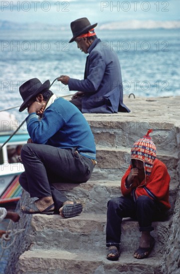 Men, boy, grandfather, father and son on Isla Taquile in Lake Titicaca, Andean Highlands, Peru,
