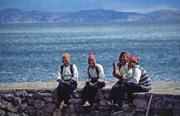Men wearing traditional clothing on Isla Taquile in Lake Titicaca, Andean Highlands, Peru, South