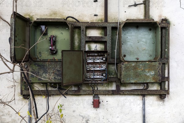Old power box, dilapidated plant of a former agricultural production cooperative of the former GDR,