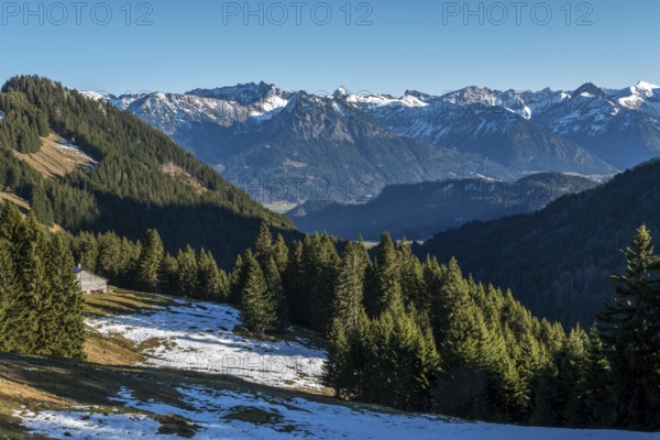 View from the high-altitude hiking trail from Bolsterlanger Horn to Riedberger Horn, snow-capped