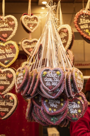 Colourful gingerbread hearts hang on the festive stands at the Stuttgart Christmas market. They are