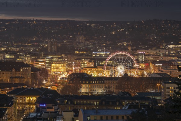 The view from above of the Stuttgart 2025 Christmas market with the Ferris wheel shows a sea of
