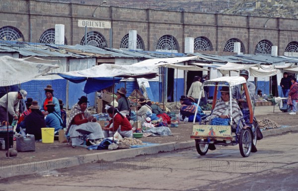 People, woman, market, rickshaw, Puno on Lake Titicaca, Andean highlands, Peru, South America,