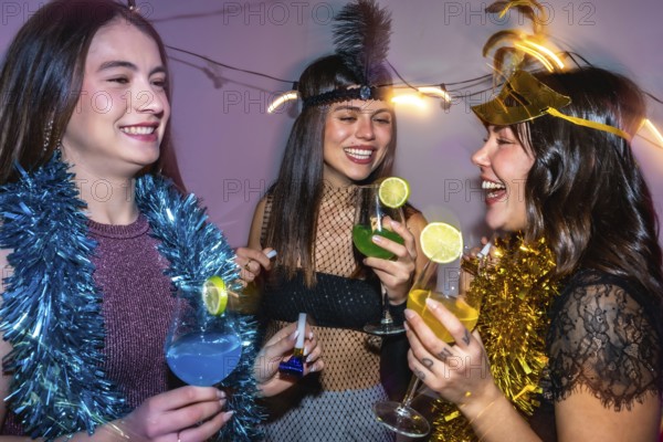 Diverse group of young women celebrating a new year's eve party or costume event, laughing and