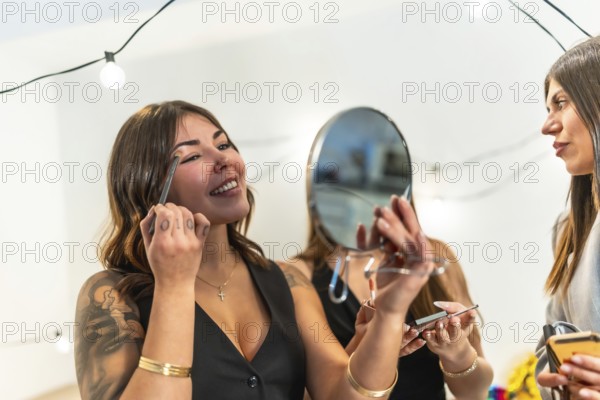Young diverse women enjoying a fun time together, preparing for a special occasion party at home by