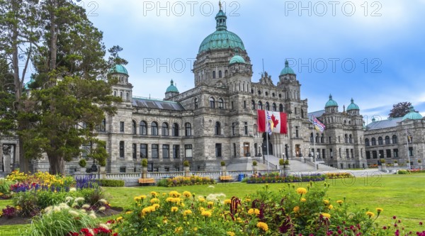 The british columbia parliament buildings stand majestically in victoria, surrounded by vibrant