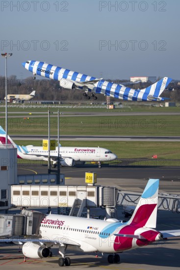 Eurowings Airbus aircraft at terminal A, Condor Airbus A330-900, taking off, Düsseldorf airport,