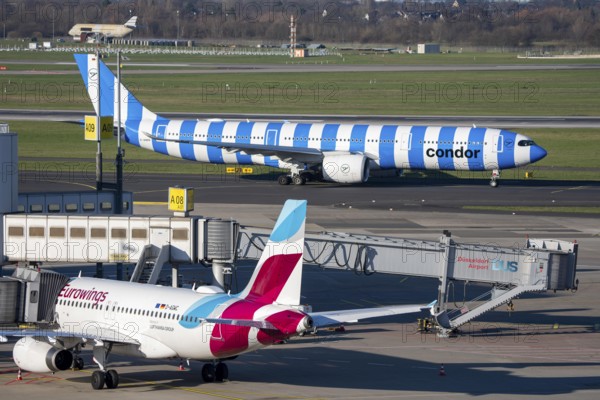 Eurowings Airbus aircraft, Condor Airbus A330-900, on the way to takeoff, at Terminal A and at