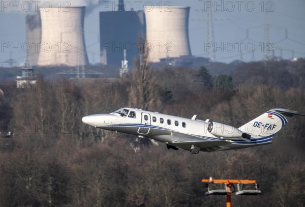 Private aircraft, Austria, OE-FAF Cessna 525A CitationJet CJ2, taking off, in the background the