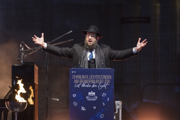 Yehuda Teichtal (Rabbi of the Chabad-Lubavitch movement) speaks at the lighting of lights to mark