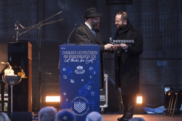 Igor Levit (pianist) receives a gift from Yehuda Teichtal (rabbi of the Chabad-Lubavitch movement)
