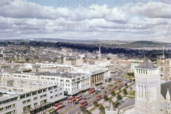View over Royal Parade city centre street with red double decker buses, Plymouth, Devon, England,