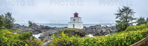 Panoramic view of amphitrite point lighthouse on the rocky ucluelet coast of vancouver island,