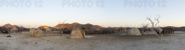Panorama, Himba huts, traditional Himba village in the savanna, arid landscape, Kaokoveld, Kunene,