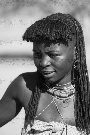 Black and white, portrait, brightly decorated woman of the Hakaona tribe, also Havakona or