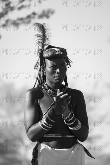 Black and white, traditional dance, brightly decorated woman of the Hakaona tribe also Havakona or