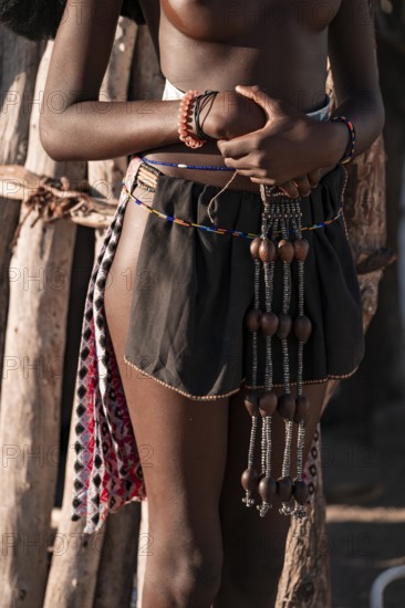 Detail, jewelry and clothing, young Himba woman, traditional Himba village, Kaokoveld, Kunene,