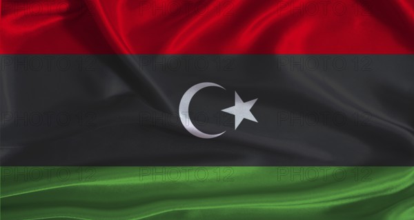 Libya flag with cloth textured background. National flag of Libya with realistic texture