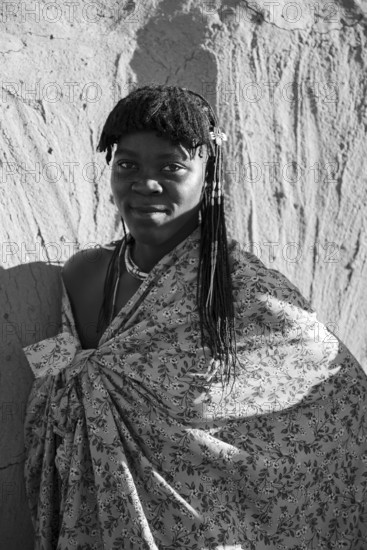Black and white, portrait, brightly decorated woman of the Hakaona tribe, also Havakona or