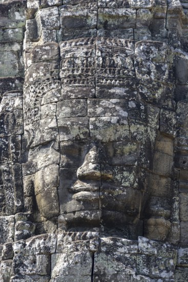 Huge stone-carved faces of Bodhisattva Lokeshvara, also Avalokiteshvara, Bayon Temple, Angkor Thom,