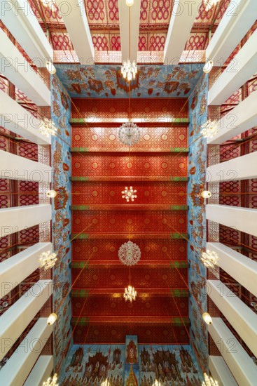 Frog's-eye view: Ubosot (ordination hall) with columns (Sao) and richly decorated ceiling (Phra