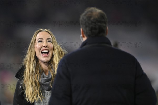 DAZN presenter reporter Sylvia Walker talking with TV expert Michael Ballack, laughs, Allianz