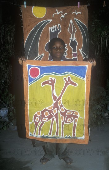 Child with a self-made picture in a self-help project in Chitungwiza near Harare, Zimbabwe, Africa,