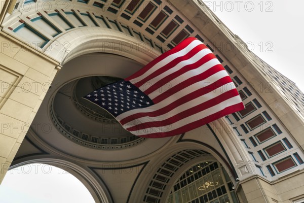 American flag fluttering, distinctive archway, Boston Harbor Hotel, Rowes Wharf, Freedom Trail,