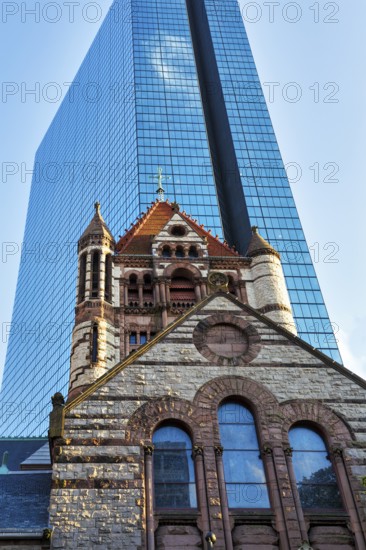 Trinity Church in front of glass façade, John Hancock Tower, various architectural styles on Copley