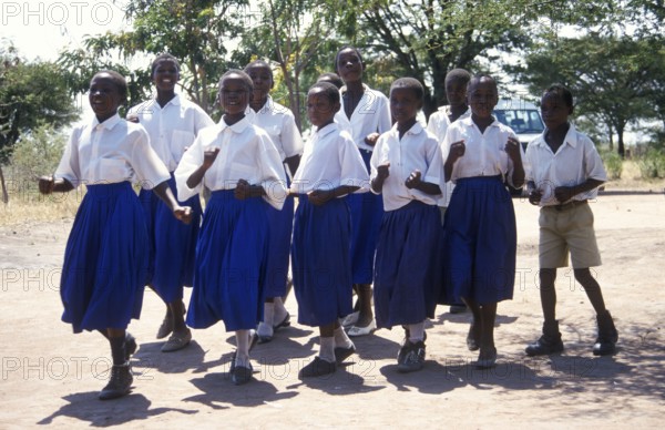 Children from a World Vision project dance on the occasion of a godfather's visit, Nyabubinza,