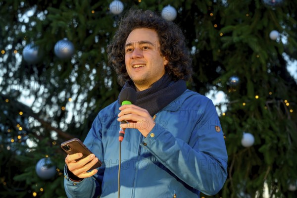 Louis Motaal speaks at Fridays for Future rally to mark the tenth anniversary of the Paris