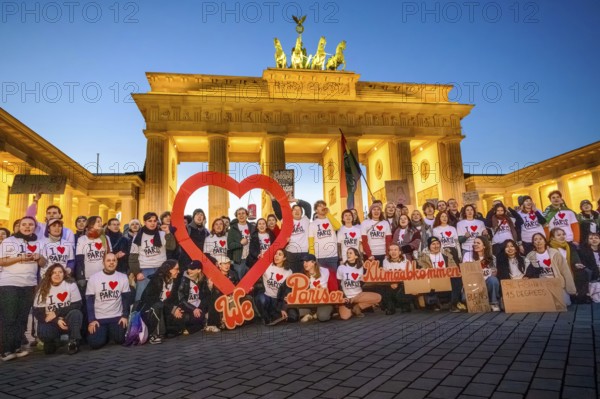 Activists from Fridays For Future pose with I love Paris T-shirts to mark the tenth anniversary of
