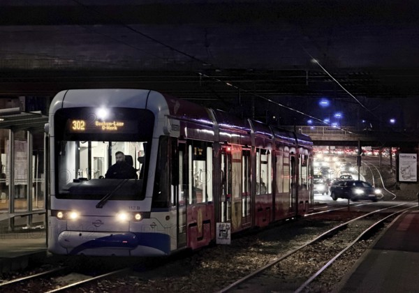 Bogestra tram line 302 at Ernst-Kuzorra-Platz der Kurt-Schumacher-Straße in the evening,