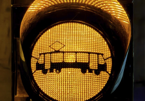 Yellow traffic light with tram symbol in the evening, Gelsenkirchen, North Rhine-Westphalia,