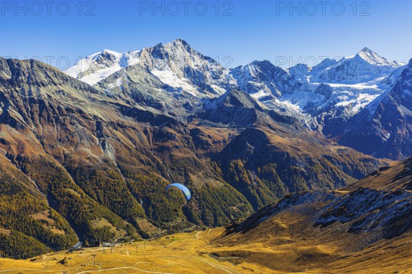 Paragliders flying against the backdrop of the Valais Alps, Val d'Anniviers, Canton of Valais,