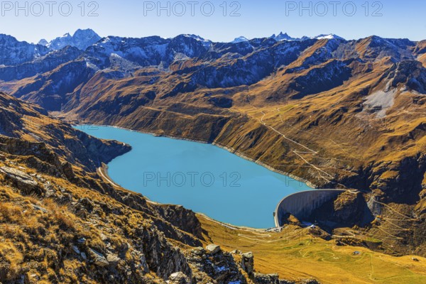The dam and the turquoise Lac de Moiry reservoir, in the back the Pointe de Moiry mountains, Val