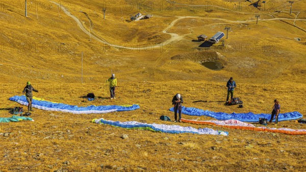 Paragliders prepare for launch, Corne de Sorebois summit, Val d'Anniviers, Valais Alps, Canton of